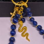 Rankų darbo rankinės ir raktų pakabukas „Nakties gyvatė“ Rankų darbo rankinės ir raktų pakabukas „Nakties gyvatė“