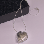 Medalionas „Tylus jausmas“